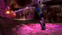 A Spartan firing a Posu'gelka-pattern needler at another Spartan on Prism.