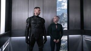 John and Makee in an elevator.
